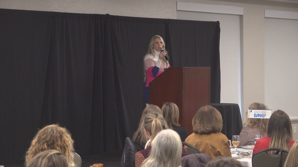 Speakers share their experiences with an audience of women