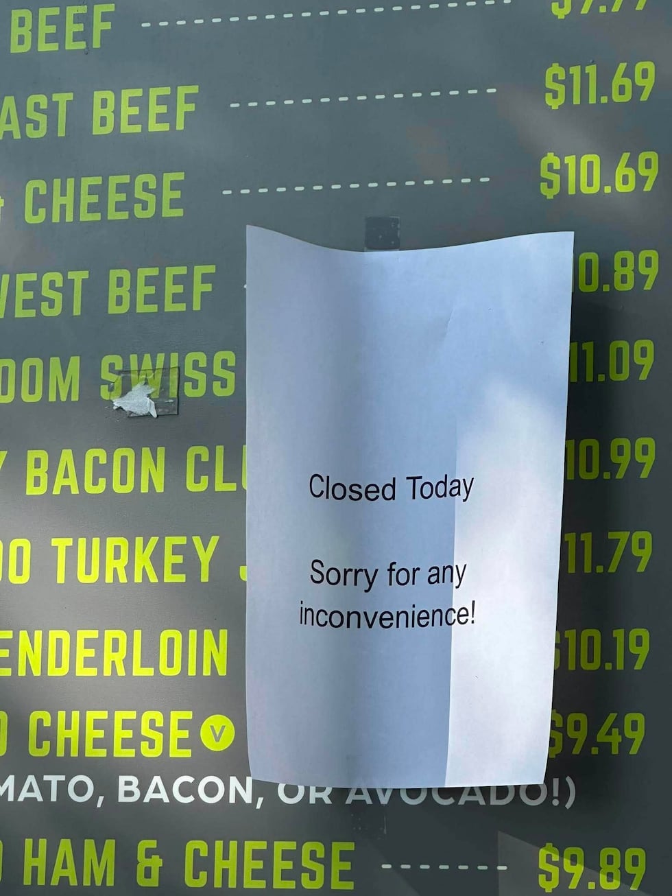 A sign posted in the drive-thru at the Beef-a-Roo location on Auburn Street tells customers...