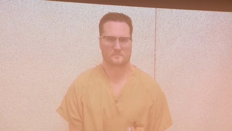 Illinois surgeon pleads not guilty to the killings of his ex-wife and her dentist husband in Ohio